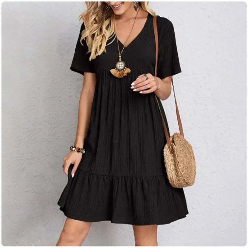 Vestido de volantes con escote en V Nuvara, caída del tejido